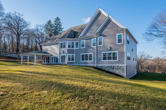34 Fox Run Rd, Redding, CT 06896 - rear view of house with a yard and a chimney