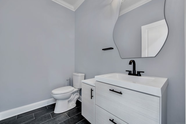 bathroom with crown molding, tile patterned flooring, vanity, and toilet