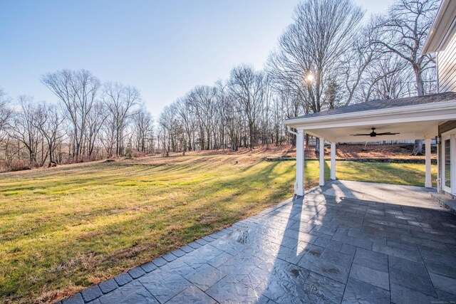 34 Fox Run Rd, Redding, CT 06896 - view of grassy yard featuring a ceiling fan and a patio