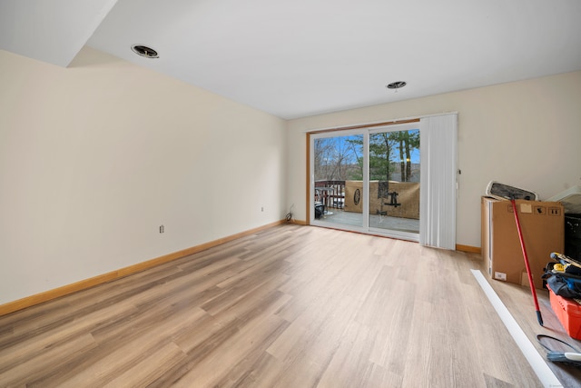 unfurnished living room featuring light wood-type flooring