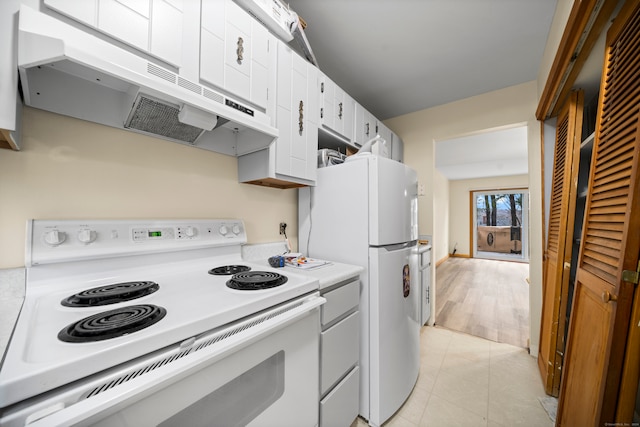 kitchen featuring white appliances, ventilation hood, white cabinetry, and light tile patterned flooring