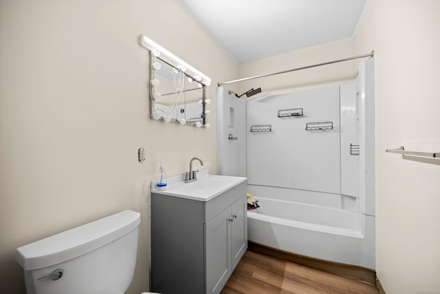 full bathroom with wood-type flooring, vanity, toilet, and shower / washtub combination