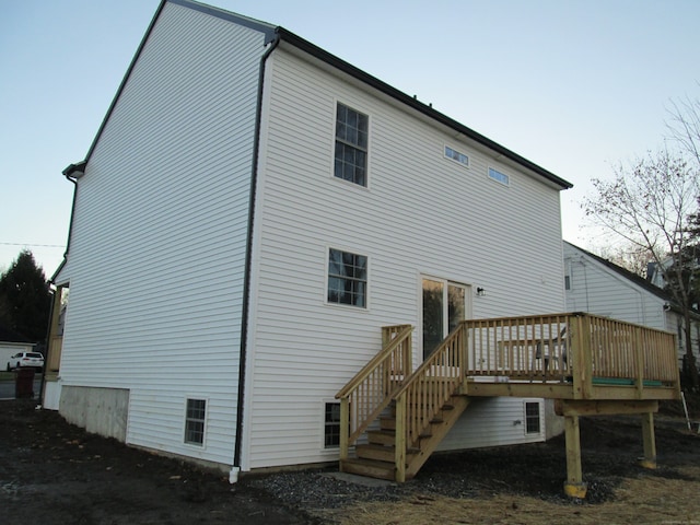 rear view of property with a wooden deck