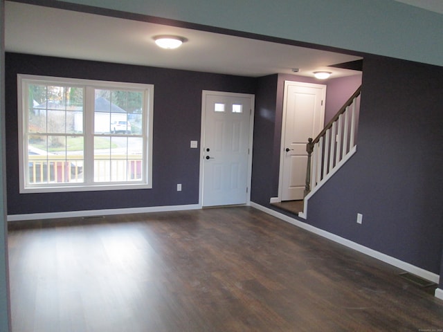 entryway with dark wood-type flooring