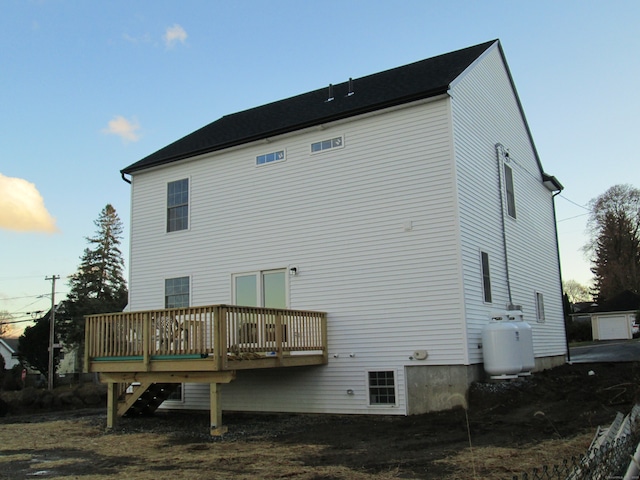 back of property featuring a deck