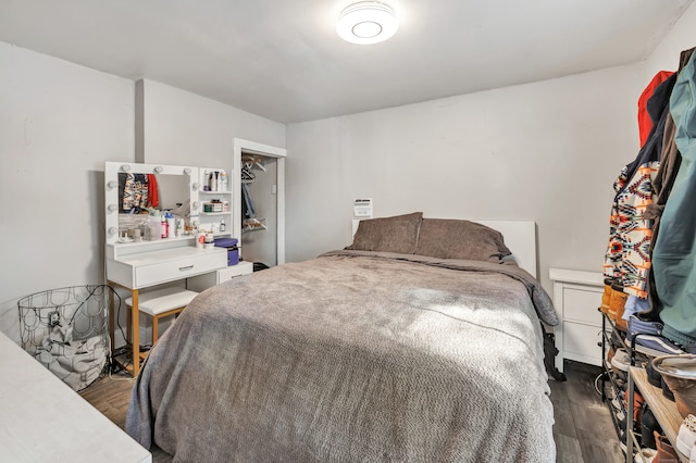 bedroom featuring a closet and dark hardwood / wood-style flooring