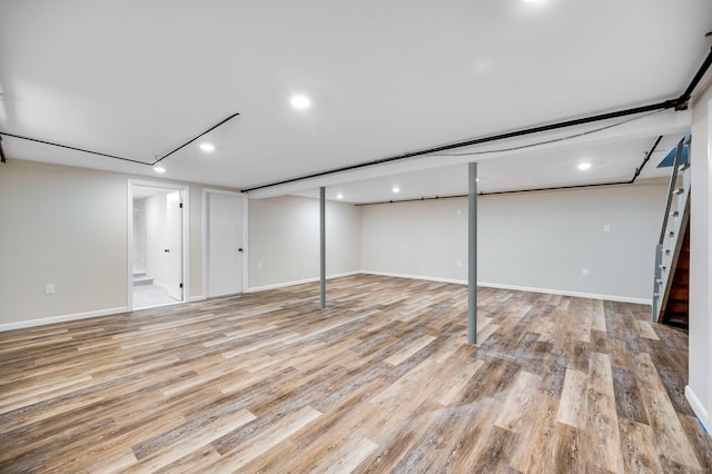 basement featuring light hardwood / wood-style flooring