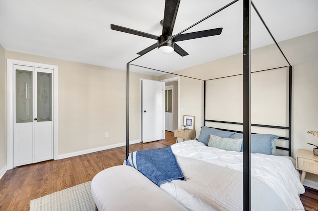 bedroom featuring hardwood / wood-style flooring and ceiling fan