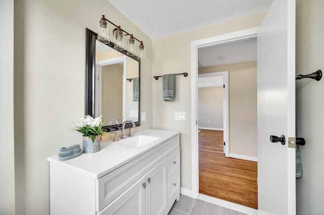 bathroom with hardwood / wood-style floors and vanity