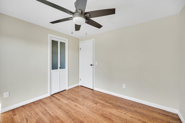 empty room featuring light hardwood / wood-style floors and ceiling fan