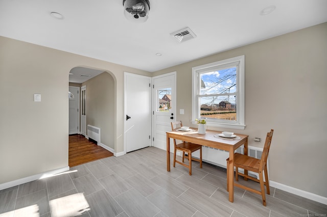 dining room featuring radiator heating unit