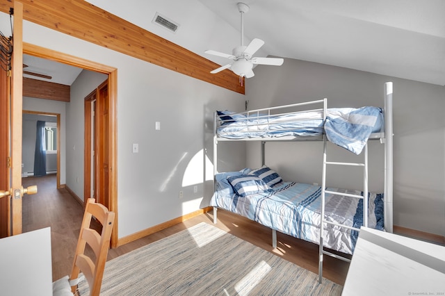 bedroom featuring wood-type flooring, vaulted ceiling, and ceiling fan