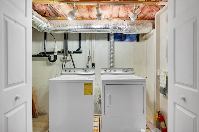 laundry room with separate washer and dryer