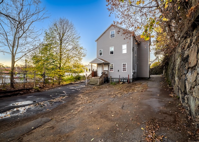 6 Grove Ct, Waterbury, CT 06710 - rear view of house featuring driveway