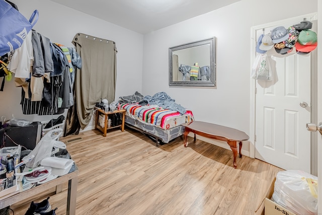 bedroom with wood-type flooring