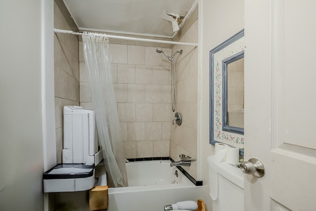 bathroom featuring shower / bath combination with curtain and toilet