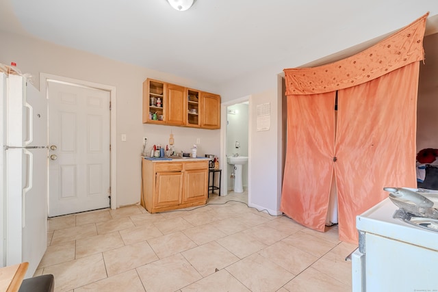 6 Grove Ct, Waterbury, CT 06710 - kitchen with freestanding refrigerator, light tile patterned flooring, a sink, light countertops, and open shelves