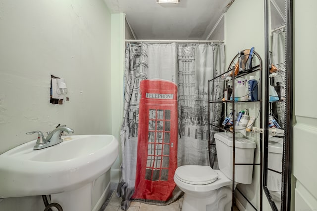 bathroom featuring tile patterned floors, sink, a shower with shower curtain, and toilet