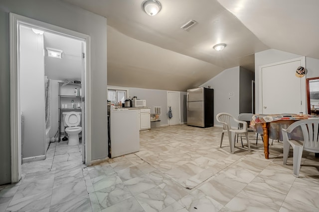 6 Grove Ct, Waterbury, CT 06710 - bonus room featuring washer / dryer, vaulted ceiling, and light marble finish floors