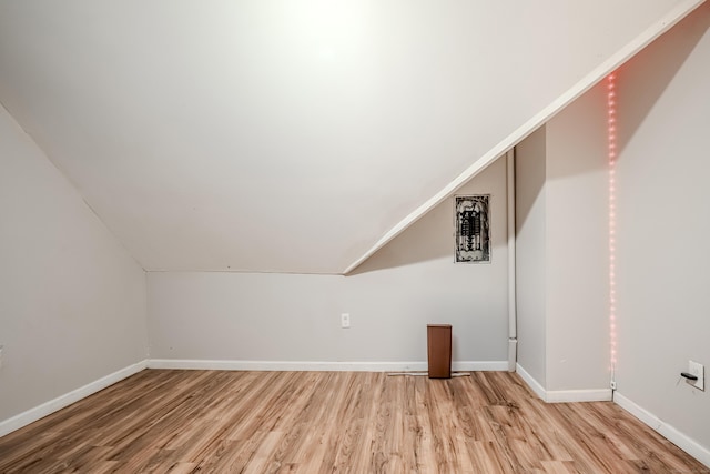 6 Grove Ct, Waterbury, CT 06710 - additional living space featuring light wood-type flooring, baseboards, and lofted ceiling
