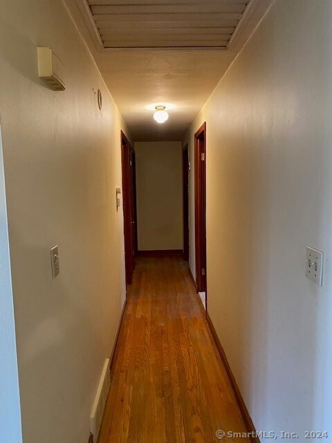 hallway featuring hardwood / wood-style floors