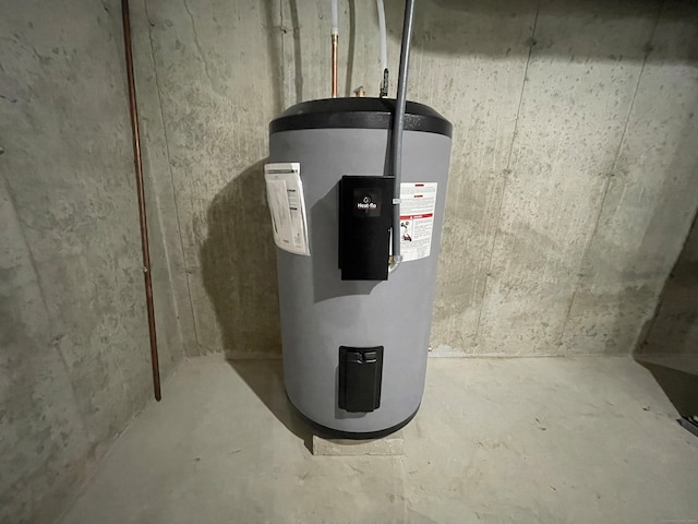 utility room with water heater