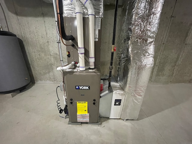 utility room with water heater