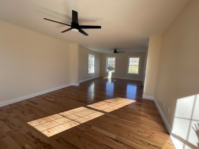 unfurnished room featuring light wood-type flooring and ceiling fan