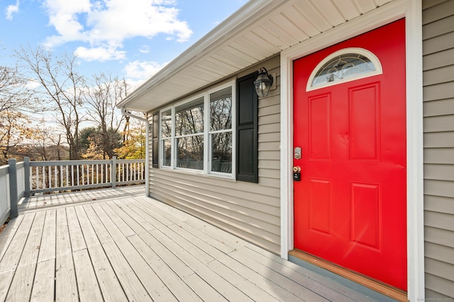 doorway to property featuring a wooden deck