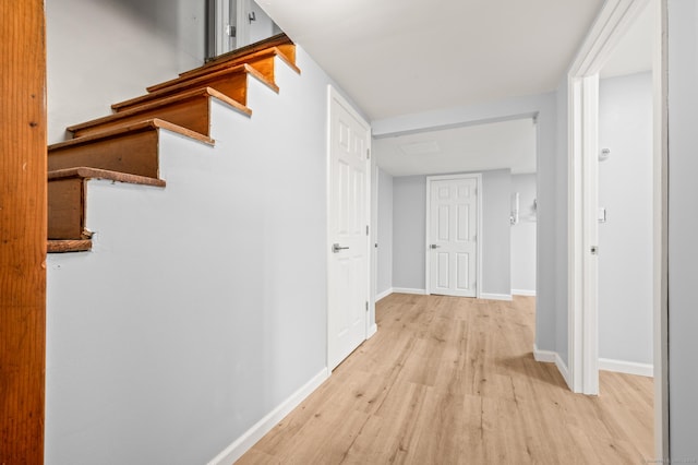 hall with light hardwood / wood-style floors