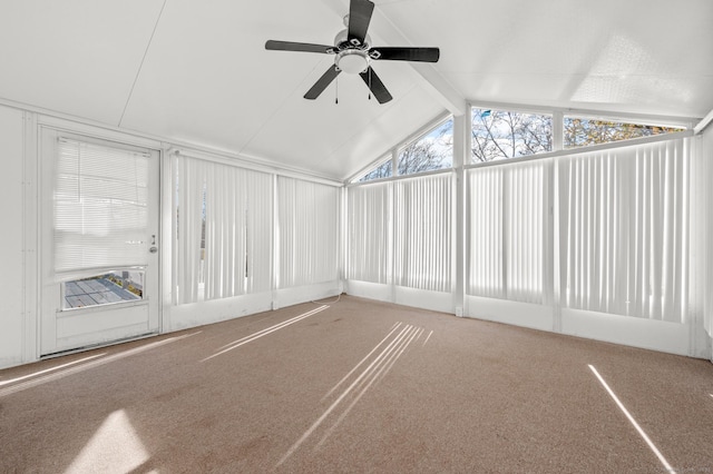 unfurnished sunroom featuring ceiling fan and vaulted ceiling with beams