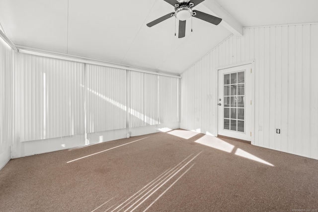 unfurnished room featuring carpet floors, lofted ceiling with beams, and ceiling fan