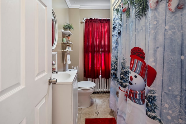 bathroom featuring radiator, vanity, crown molding, tile patterned flooring, and toilet