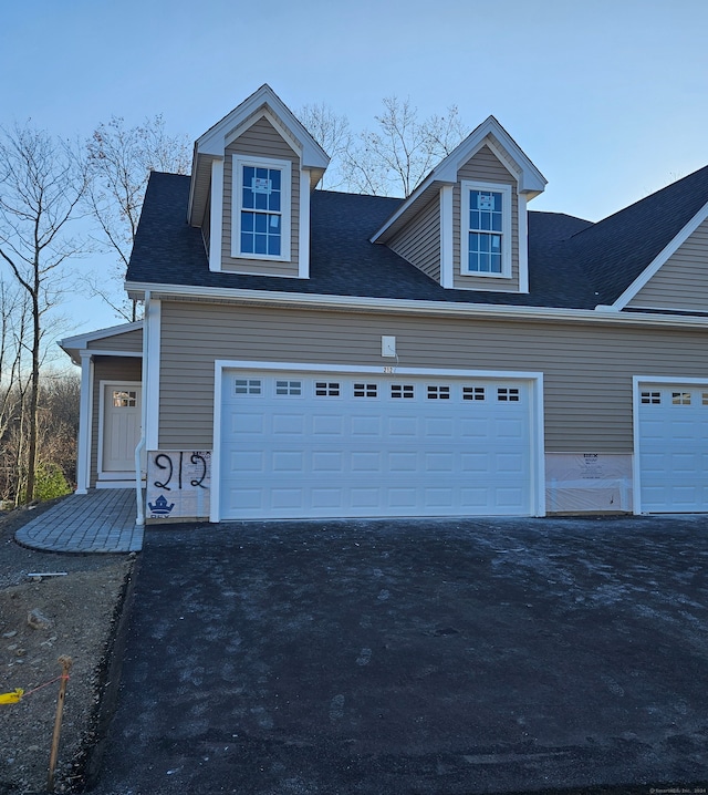 view of front of property featuring a garage