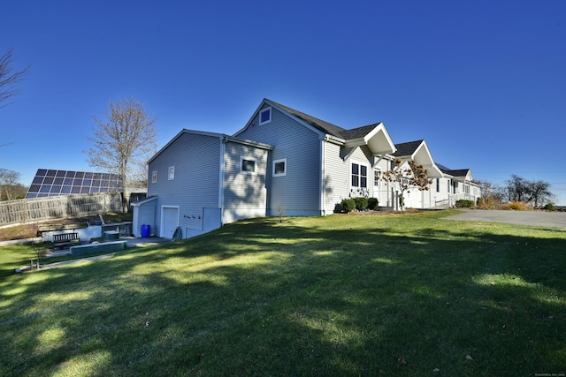 view of property exterior with a yard