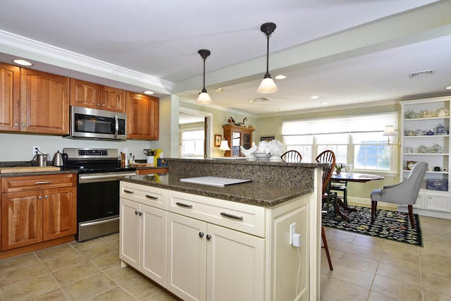 kitchen with stainless steel appliances, dark stone countertops, pendant lighting, a breakfast bar area, and ornamental molding