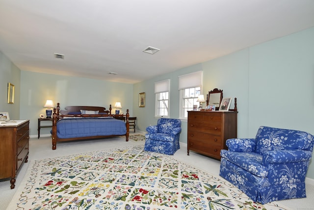 bedroom featuring light colored carpet