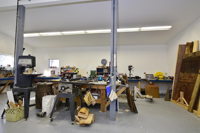 interior space with a workshop area and plenty of natural light