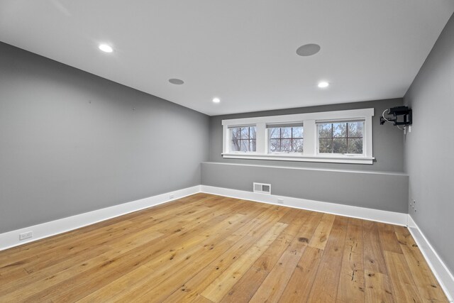 spare room featuring light hardwood / wood-style flooring