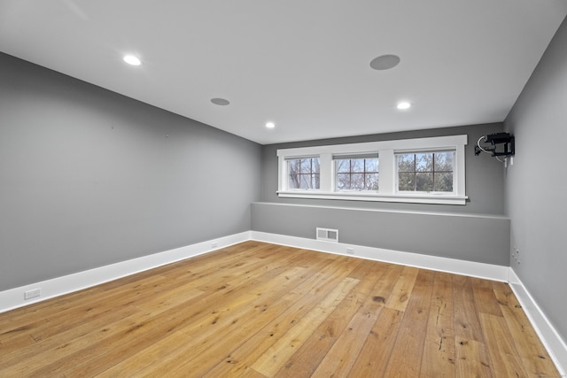 empty room with light hardwood / wood-style floors