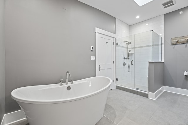 bathroom with separate shower and tub