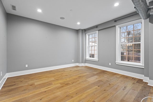 unfurnished room featuring light hardwood / wood-style flooring