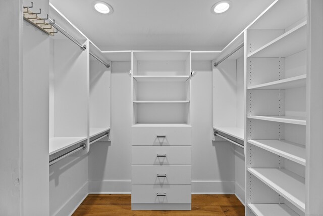 spacious closet featuring hardwood / wood-style flooring