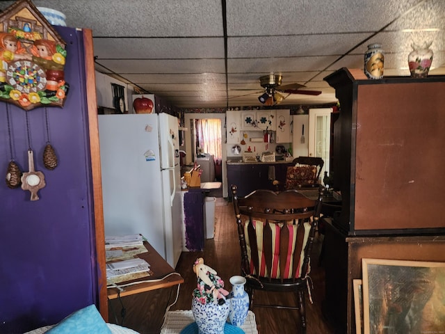 kitchen with a paneled ceiling, ceiling fan, white fridge, and washer / dryer