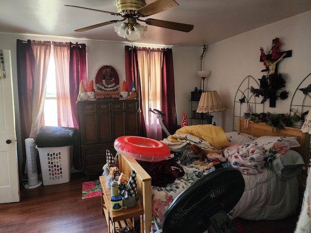 bedroom with ceiling fan and dark hardwood / wood-style floors