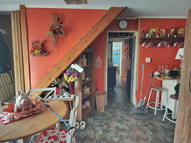 dining area featuring ornamental molding