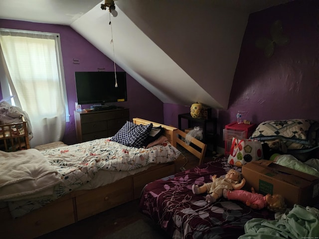 bedroom featuring ceiling fan and lofted ceiling