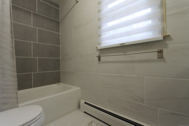 bathroom with shower / bathtub combination with curtain, toilet, baseboard heating, and tile walls