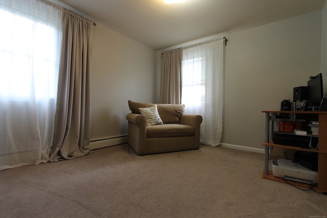 living area with vaulted ceiling, light colored carpet, and a baseboard radiator