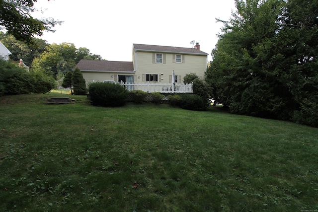 view of yard featuring a wooden deck